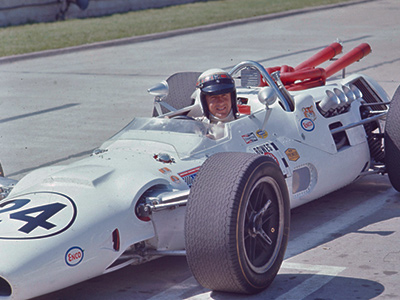 Jackie Stewart in his freshly-built #24 Bowes Fast Seal Lola T92 at the 1967 Indy 500. Licenced by The Henry Ford under Creative Commons licence Attribution-NonCommercial-NoDerivs 2.0 Generic. Original image has been cropped. Jackie Stewart in his freshly-built #24 Bowes Fast Seal Lola T92 at the 1967 Indy 500. Licenced by The Henry Ford under Creative Commons licence Attribution-NonCommercial-NoDerivs 2.0 Generic. Original image has been cropped.